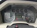 Dashboard of a 2008 Ford F-350 displaying gauges for RPM speed and fuel level along with a digital odometer reading 868253.0 km