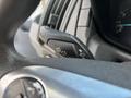 Close-up of a control stalk for turn signals and headlights in a 2018 Ford Transit-350 interior
