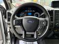 Steering wheel of a 2017 Ford F-350 SD with controls for audio and cruise settings visible