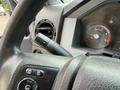 Close-up of the dashboard controls in a 2017 Ford F-750 showing the steering wheel and various buttons for infotainment and settings