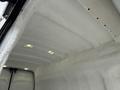 Interior view of a 2017 Ford Transit showing a white textured ceiling with overhead lights