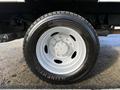 Close-up of a tire mounted on a wheel of a 2008 Ford F-550 with a white rim and a Continental tire featuring a tread pattern designed for heavy-duty use