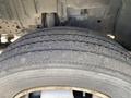 A close-up view of a tire from a 2019 Hino 195 showing tread patterns and grooves on the rubber surface