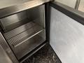 A 2020 Freightliner MT45 with an open side compartment revealing a metal shelf and interior space without contents