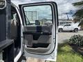 A white 2017 Ford F-550 truck with an open driver's side door showcasing the interior features and layout