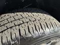 Close-up of a tire from a 2021 Ford F-150 showing detailed tread patterns and rubber texture