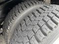 Close-up of a tire from a 2018 Ford Econoline showcasing the tread pattern and surface texture