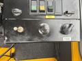 Control panel of a 2004 Bombardier SW48 featuring switches for trail, warning light, and a fan control knob