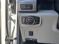 Control panel of a 2019 Ford F-550 featuring various buttons for lights and a brake release
