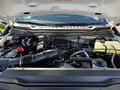 The engine compartment of a 2024 Ford F-550 showing the engine block air intake and various engine components and fluids