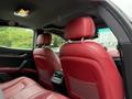 Interior of a 2016 Maserati Ghibli featuring plush red leather seats and headrests with a sleek dashboard design