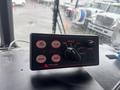 A control panel with buttons labeled for air horn, cycle, manual, yelp, volume, brake, and radio