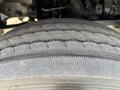 Close-up of a worn tire on a 2013 RAM 5500 showing visible tread wear and grooves