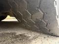 A close-up of a tire from a 2016 Grande West Vicinity showing the tread pattern and texture