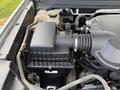 Close-up of the engine compartment of a 2018 Chevrolet Colorado featuring the air intake system and various hoses and components