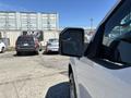 A 2019 Ford F-150 facing sideways with its passenger side mirror prominently displayed