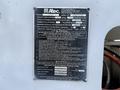 A black and silver metal label with operating instructions and specifications for an Altec Industries bucket truck model LV55