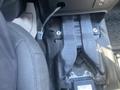 A 2020 Ford Explorer with a close-up view of the console area showing the interior components and wiring