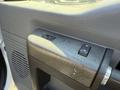 Close-up of the control panel of a 2012 Ford F-350 SD with window and mirror adjustment buttons