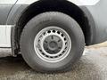 Close-up of a wheel and tire from a 2023 Mercedes-Benz Sprinter showing the alloy rim and tread pattern