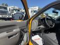 A 2013 Chevrolet Silverado 1500 interior showcasing the driver's side with a steering wheel and control panel visible