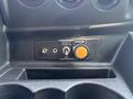 Close-up of control panel with buttons and switches on a 2019 Ford Transit 350 including a power switch and a strobe light button