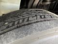 Close-up of a tire tread on a 2011 International 4300 showing detailed grooves and wear patterns along the rubber surface