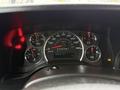 Dashboard of a 2020 Chevrolet Express showing speedometer fuel gauge and odometer with various warning lights illuminated