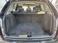The interior of a 2013 BMW X3 showcasing the cargo area with a flat floor and no visible items or seats in the back