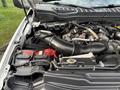 2017 Ford F-350 SD engine compartment showcasing the engine components and battery with visible hoses and wiring