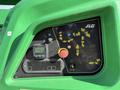 Control panel of a 2015 JLG 450AJ featuring various buttons indicators and diagrams for operating the lift equipment
