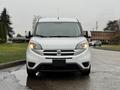 A white 2017 RAM ProMaster City van facing forward with a simple front design featuring headlights and a grille with the RAM logo