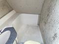 Interior of a 2013 Larson 238 featuring a white shower area with a blue countertop and a toilet in the corner showing some signs of wear and mold on the walls