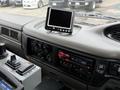 The interior dashboard of a 2009 UD Trucks UD 3300 featuring a digital display monitor and audio controls