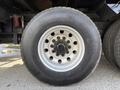 Close-up of a 2008 Kenworth T370 tire showcasing a Michelin brand with a silver rim and visible lug nuts