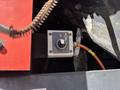 A close-up view of a control switch on a Sandvik Ranger DX800 featuring a circular knob and an indicator symbol