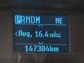 Dashboard display of a 2018 Ford Transit showing average fuel consumption as 16.4 liters per 100 kilometers and total distance traveled as 147384 kilometers