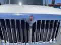 Front view of a 2014 International TerraStar truck showcasing its chrome grille and emblem