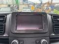 The dashboard of a 2023 RAM Promaster 3500 featuring a central touchscreen display with visible wear and control buttons below it