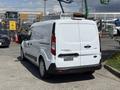 A white 2021 Ford Transit Connect van showing the rear view with the model name and trim designation visible on the back door