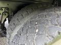 Close-up of a worn tire on a 1996 Kenworth T800 showing deep treads and visible cracking on the rubber surface