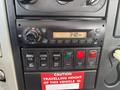 The control panel of a 2012 International 7300 Workstar featuring various buttons dials and a digital clock displaying the time as 3:40 PM