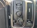 The control panel of a 2017 Chevrolet Silverado 1500 featuring buttons for four-wheel drive settings and climate controls