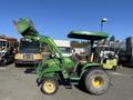 A 2008 John Deere 3320 300X tractor with a green body and front loader bucket attached in a side profile view