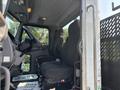 2020 Peterbilt 330 truck interior focusing on the driver seat and dashboard with controls visible