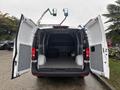 A 2021 Mercedes-Benz Metris with the rear doors open revealing a spacious cargo area inside