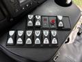 A control panel from a 2020 Chevrolet Express featuring various buttons for mirror defrost, dome lights, lift door, and other functions