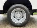 Close-up view of a silver steel wheel and tire from a 2018 Ford F-550 featuring a five-bolt pattern and a rugged tread design
