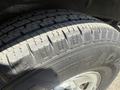 Close-up of a tire from a 2017 Chevrolet Express showing detailed tread pattern with the word TRAC visible on the sidewall