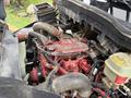 Close-up view of a 2020 International MV607 engine showcasing red components pipes and hoses